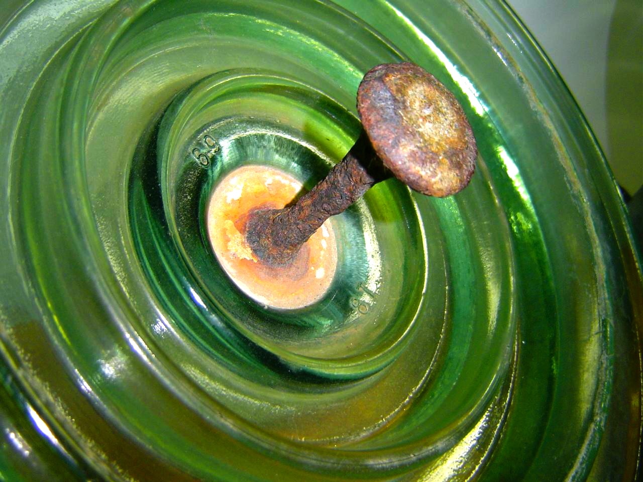 Bad-things-7 Bad-things-7 7.Corroded pin on glass disc operating in contaminated coastal/desert environment (photo courtesy R. Znaidi/STEG). insulator Bad Things Can Happen to Insulators Bad things 7
