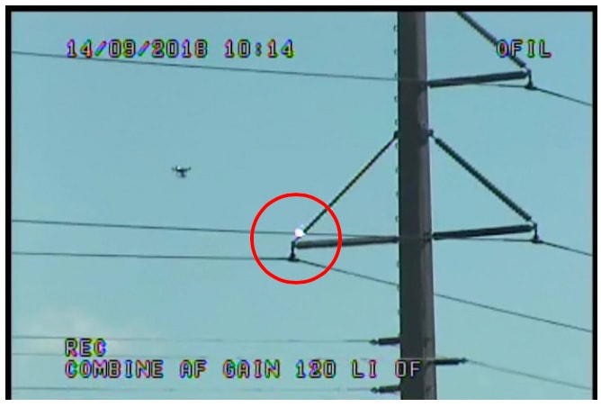 Drone capturing visual images of where corona activity was detected on insulator