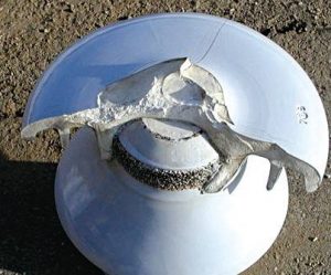 Failure of defective porcelain insulator due to radial cracking. Modes of insulator failure.