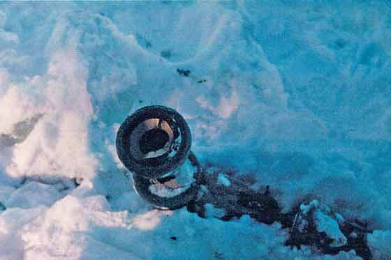 Separated insulator string found just alongside toppled 735 kV tower.