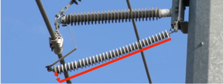 Example of bending through of horizontally installed NGLA. Such bending can affect electrical connections between individual metal oxide, non-linear resistor blocks. It could also impact integrity of sealing of polymeric housing.