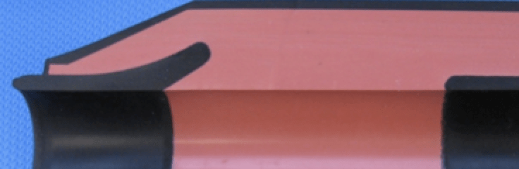 Fig. 2: Field grading parts in silicone elastomer joint (left: at cable side, right: covering connector, top: outer conductive layer).