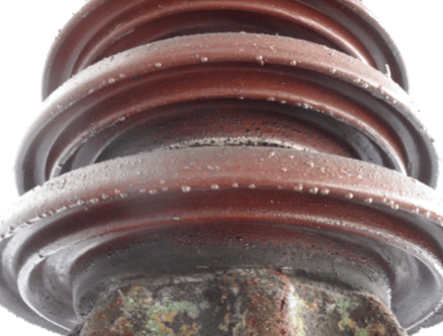Fig. 8: Section of 380 kV brown porcelain busbar post insulator with grease.