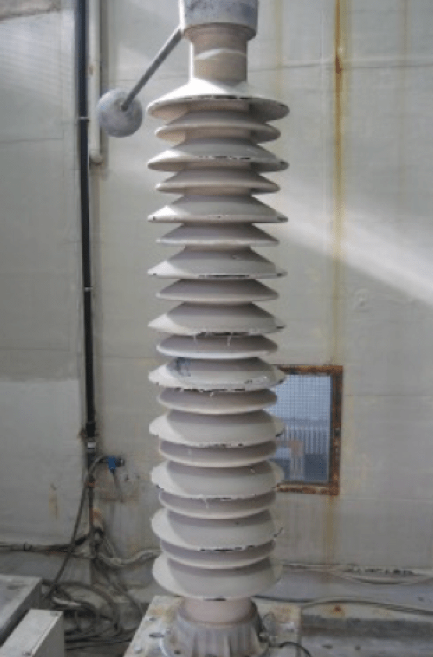 Fig. 9: Section of 380 kV busbar brown porcelain post insulator with in-field applied RTV coating after 7 years operation.