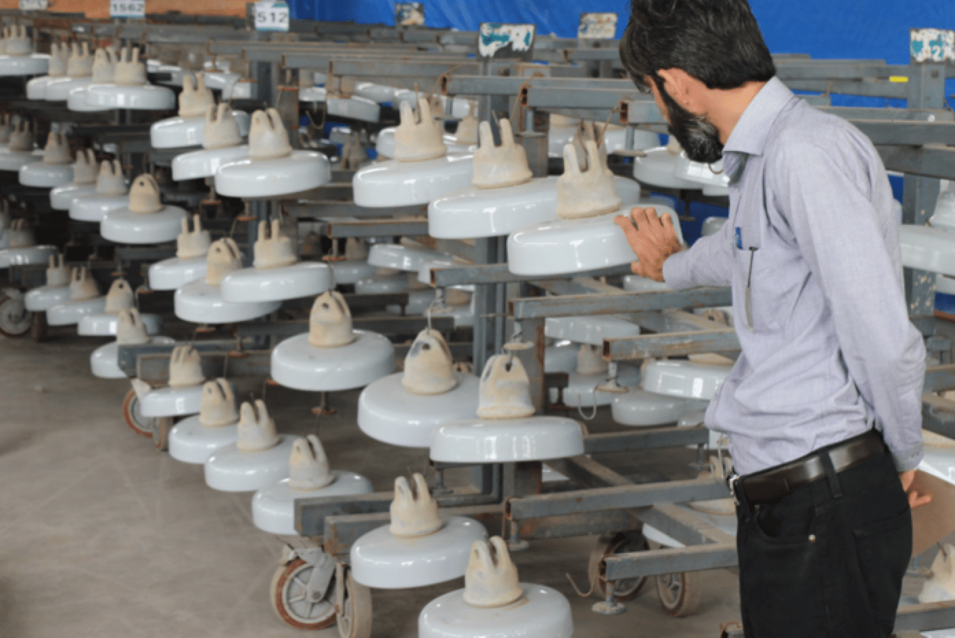 Insulators-removed-from-lines-are-cleaned-and-readied-for-coating-with-RTV-silicone-material Insulators-removed-from-lines-are-cleaned-and-readied-for-coating-with-RTV-silicone-material Transmission Grid in Pakistan Confronts Dual Challenges of Pollution & Icing (Part 1 of 2) Insulators removed from lines are cleaned and readied for coating with RTV silicone material